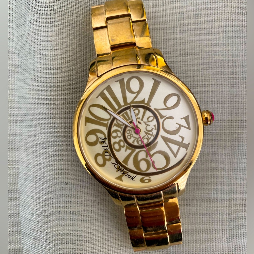 Gold spiral faced Betsey Johnson watch